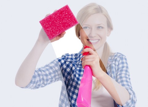 Local cleaner working in a Kensington property with careful attention to detail