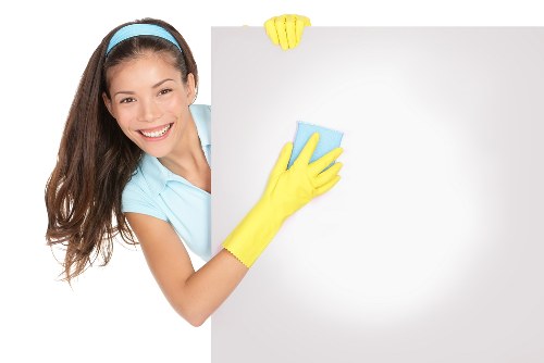 Cleaning team working on a Kensington apartment kitchen during move out cleaning